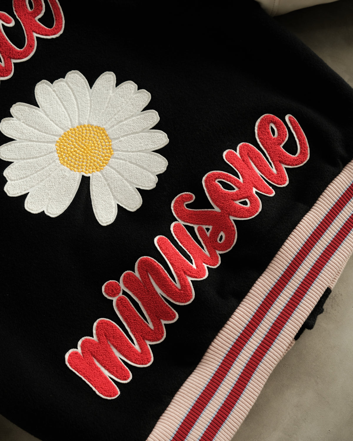 ss22 PEACEMINUSONE
Delivers Collared Varsity
Jackets